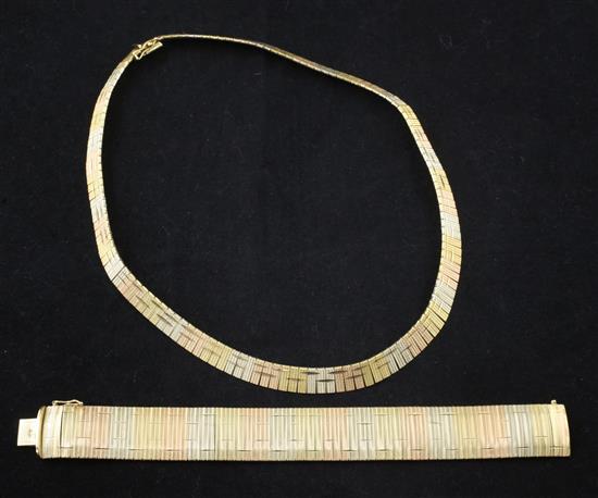 A modern Middle Eastern three colour 18ct gold bracelet and matching necklace, bracelet 7.25in.